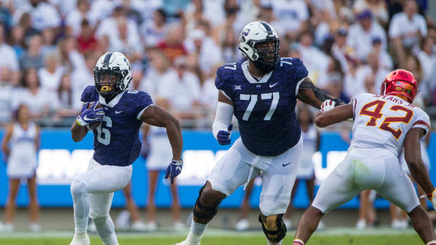 Sep 29, 2018; Fort Worth, TX, USA; TCU Horned Frogs running back Darius Anderson (6) and offensive tackle Lucas Niang (77) in action during the game against the Iowa State Cyclones at Amon G. Carter Stadium.